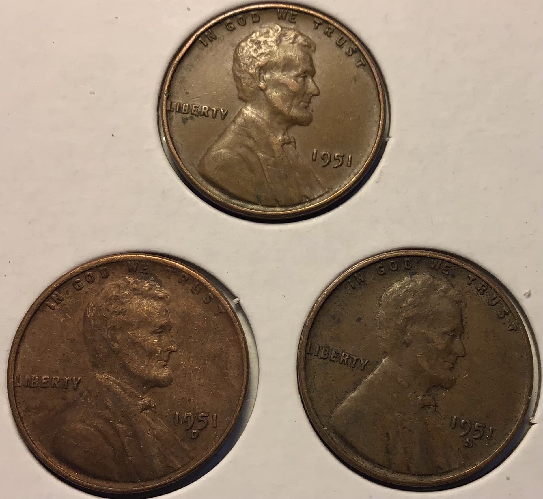 Group of four 1951 wheat pennies including Philadelphia, Denver, San Francisco, and proof specimens